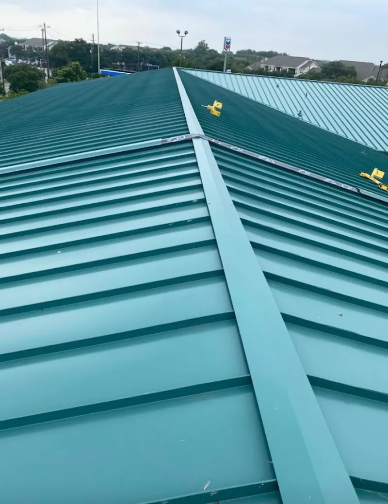 Green commercial metal roof ridge and valley for Metal Roof Repair in Bangor Base